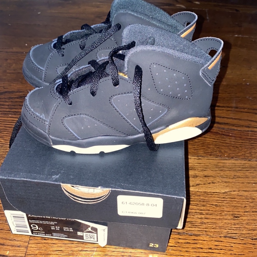 Black and gold Jordan 6 retros